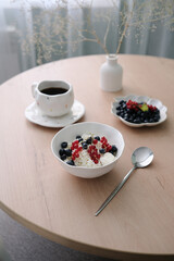 Enjoy a Delicious and Nutritious Healthy Breakfast featuring Fresh Berries and Coffee