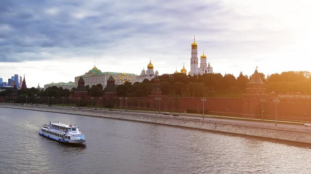 MOSCOW, RUSSIA - JUNE 4 2017: motor ship sails along River. Moscow Kremlin. Ivan Great Bell-Tower. Dormition Cathedral. Taynitskaya, Blagoveschenskaya (Annunciation) and Second Nameless Towers.