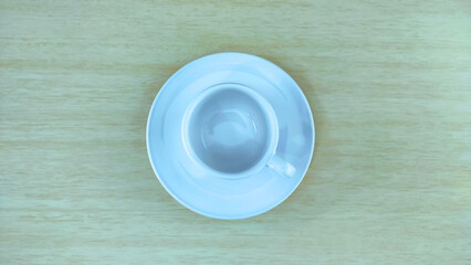  Top view of empty white mug on the wooden table with copy space. Image concept. Can used as backgroud or banner.
