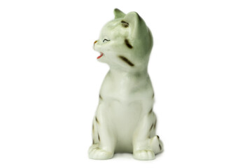 Antique figurine of a cat on a white isolated background. Vintage porcelain 
