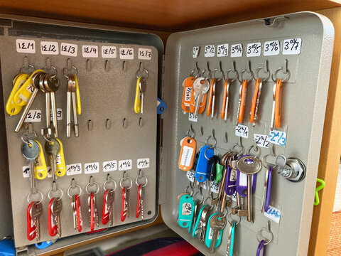 Key box with keys and colored tags Key cabinet lock hanging inside by number for storage