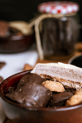 Chocolate chip cookies, dark and white chocolate bar, small bowl of oatmeal and nuts. International Chocolate Day.