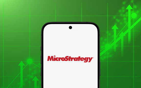 MicroStrategy logo is displayed on a modern smartphone green rising chart in the background, investment, stock exchange. trading, business intelligence, Bitcoin, data mining, ai, solutions, software