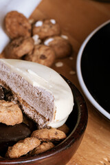 Chocolate chip cookies, dark and white chocolate bar, small bowl of oatmeal and nuts. International Chocolate Day.