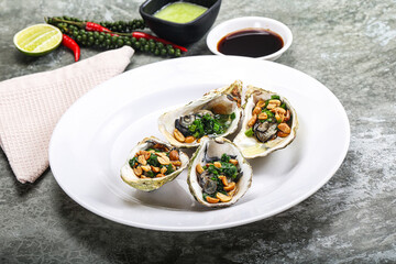 Open half oysters with green onion