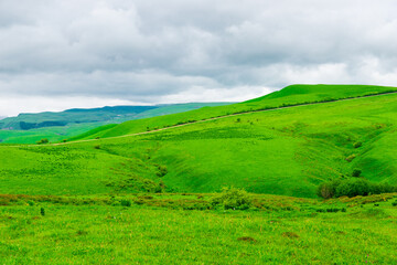 Fototapeta premium Picturesque green hills in cloudy weather. Caucasus