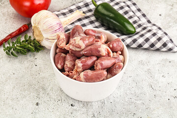 Fresh raw chicken hearts in the bowl