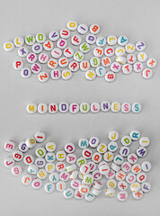 Mindfulness Concept with Colorful Alphabet Beads