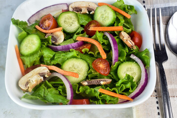 salad of  cucmbers, tomatoes  onions and mushrooms