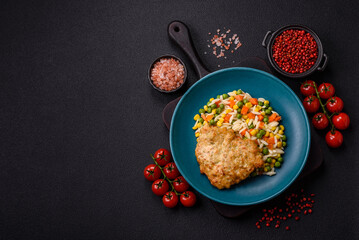 Delicious boiled rice with vegetables or risotto with carrots, peas and corn