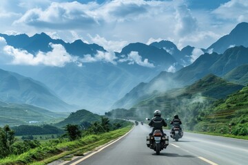 a group of people on motorcycles traveling along a road against a mountainous background