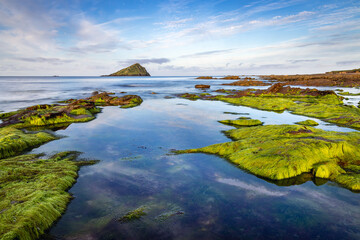 Wembury Bay looking out toward the Great Mewstone on the south Devon coast, England.