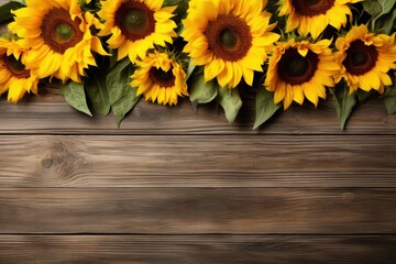 sunflowers on wooden board, top view