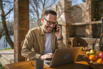 One adult man in front house in day use smart phone talk make a call