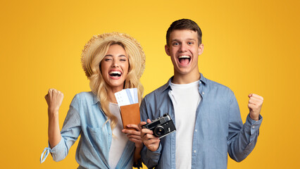 Getting visa. Lucky couple holding passports with tickets and retro photo camera, ready for travel.