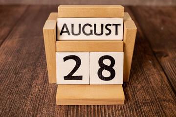 Wooden block calendar with the date August 28
