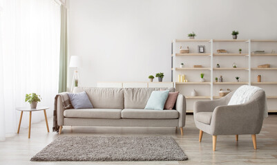 Cozy scandinavian style and modern design at home. Retro armchair and sofa, soft carpet, shelf with accessories and large window with daylight in living room interior, flat lay, panorama, free space