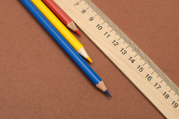 Colored pencils and school wooden measuring ruler