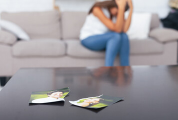 Unrecognizable Woman Crying After Breakup With Ex Boyfriend Sitting On Sofa Indoor, Torn Apart...