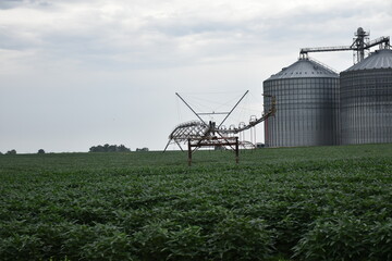 Irrigation System and Grain Bins in a Farm Field