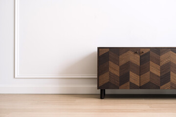 Wooden retro commode against white copy space wall on background