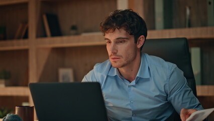 Fototapeta premium Financial manager rejoicing success working late workplace close up. Man dancing