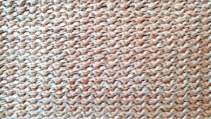 Wicker texture. Wicker beige background. Interior design wicker. Wicker ornament made from natural materials. Knitted ornament beige color.