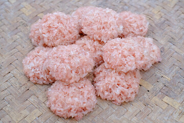Raw Rengginang or Rengginang on the woven bamboo, Indonesian Traditional Rice Cracker, made from Rice or Glutinous Rice, Savory and Crunchy.
