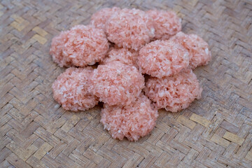 Raw Rengginang or Rengginang on the woven bamboo, Indonesian Traditional Rice Cracker, made from Rice or Glutinous Rice, Savory and Crunchy.