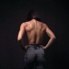 beautiful young woman topless with muscle