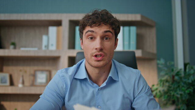 Employee calling web camera at workspace closeup. Manager discuss market graph