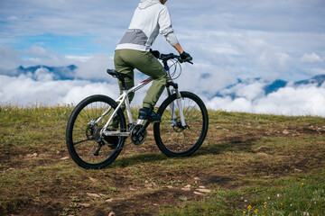 Fototapeta premium Riding mountain bike on beautiful mountain top