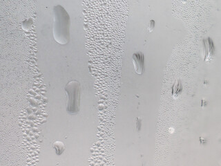 Drops of ice on a silver-colored drinking glass