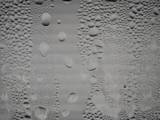 Drops of water on a silver-bronze coffee mug