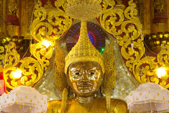 Face of large golden seated Buddha image is the main Buddha image in the Mahamuni Phrya Temple Church. It is located on the Rakhine State , Myanmar.