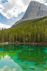 Breathtaking views of the upper and lower Grassi Lakes with brilliant turquoise and aqua waters set in a serene wilderness outside the town of Canmore near Kananaskis during the summer season.