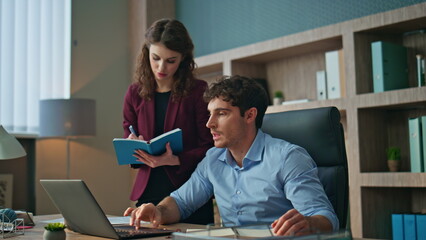 Secretary writing boss instructions standing company office. Ceo giving tasks