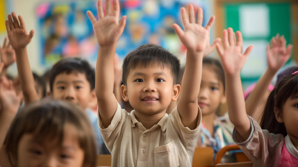 Fototapeta premium Young Children Enthusiastically Raising Hands During Classroom Discussion in Local School