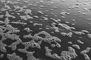 Bubbles from Ocean Waves Scattered on the Shoreline