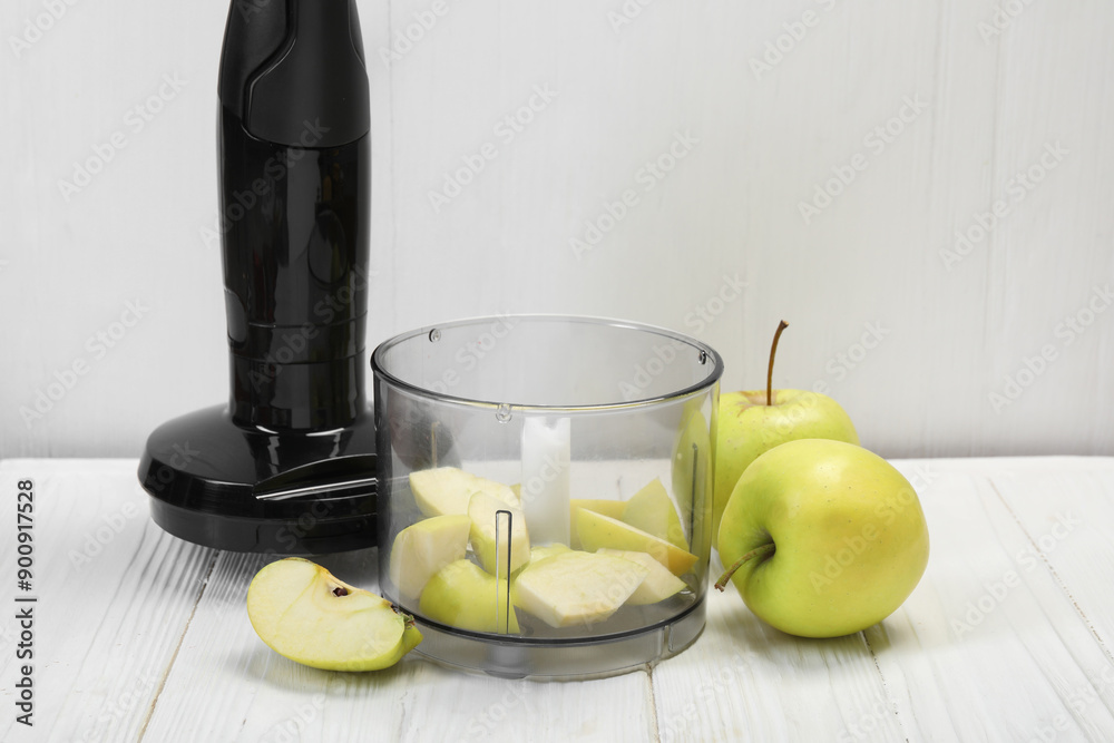 Poster hand blender kit and fresh apples on white wooden table