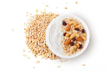 natural yogurt with oats and nuts in ceramic bowl top view isolated white background