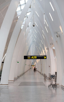 Kastrup, Denmark - 01-16-24: White hallways of high gate A at cph lufthavn. Early morning at the empty Copenhagen airport. White structured buidling with clean Scandinavian architecture