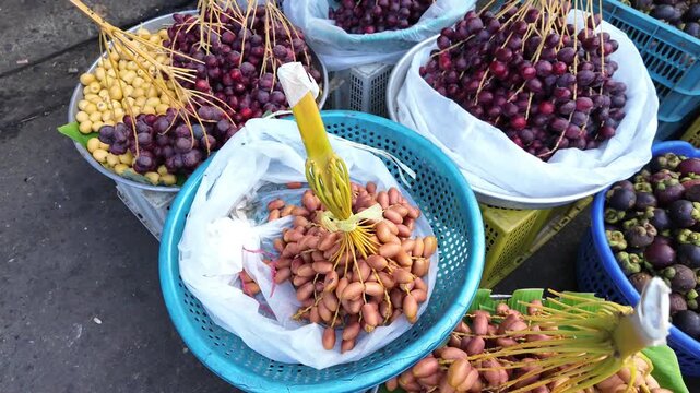 Date palm fruit for sale show on card at outdoor fruits market, Cho Lon, Vietnam
