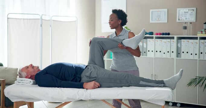 Physiotherapist, stretching and legs of mature man in clinic for wellness, physiotherapy and exercise. Senior person, massage and knee rehabilitation with osteoporosis, sciatica or stroke for health