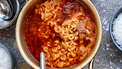 A bowl of spicy ramyeon with meat. delicious korean food.