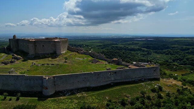 Wide angle view of historic Chlemoutsi Castle Museum in Elis, Greece during afternoon on a cloudy day. Pan shot.