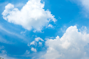 Tropical summer blue sky fluffy white cloud summertime on light sunny day cloudscape. Clear bright blue skyline spring sunlight climate background. Heaven blue environment ecology high scenic nature.