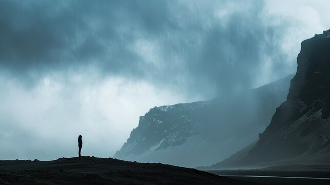 Icelandic storm with windbag and silhouetted mountains, creative business ideas and overcoming obstacles