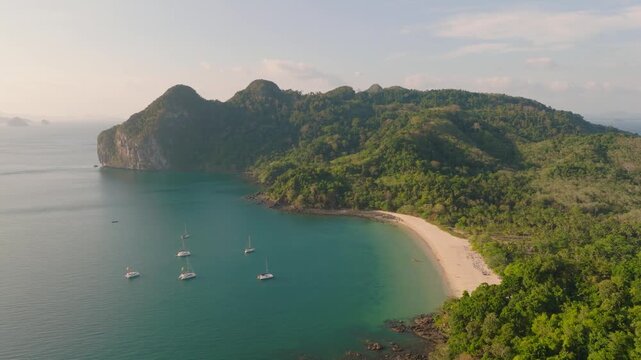 4K aerial drone footage of Thailand bay, beach and rocks, Koh Mook, Ko Muk, boats, Asia