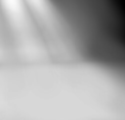 Spotlights illuminate empty stage background.